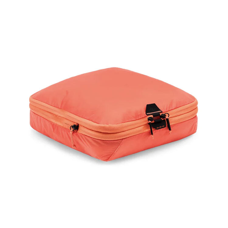 Peak Design Packing Cube Medium in coral color with compressible design and tear-away zipper for easy access