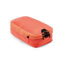 Small Peak Design Packing Cube in coral with tear-away zipper and expandable compartments for organized travel packing