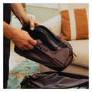 Peak Design Shoe Pouch in use storing shoes, ultralight and packable travel accessory