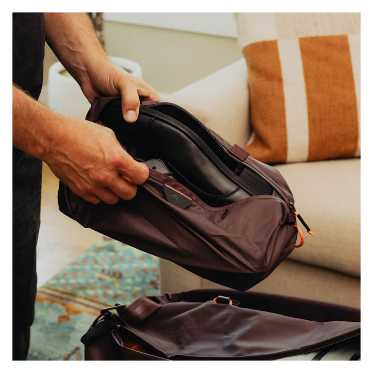 Peak Design Shoe Pouch in use storing shoes, ultralight and packable travel accessory