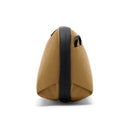 Small brown Peak Design Tech Pouch in Coyote X-Pac Ocean Edition fabric with black zipper and handle, standing upright side view