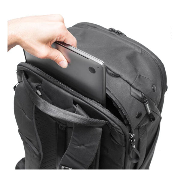 Black Peak Design Travel Backpack with side pocket holding a tablet device