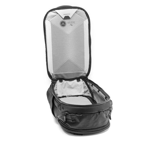 Open Peak Design Travel Backpack 45L in black showing spacious main compartment with divider and top lid interior pockets