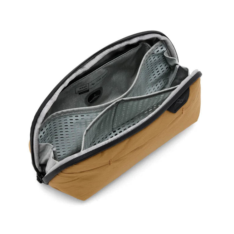 Peak Design Wash Pouch small toiletry bag in coyote color with multiple compartments and eco-friendly fabric.