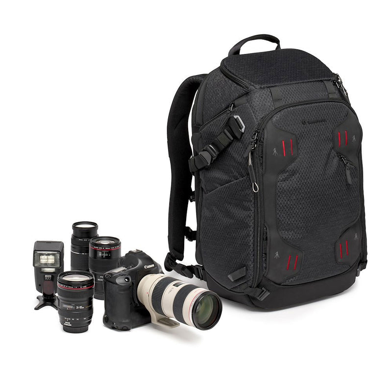 Black camera backpack with camera equipment on a white background