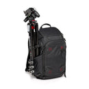 Black backpack with a tripod attached to the side.