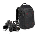 Black camera backpack with video camera equipment on a white background