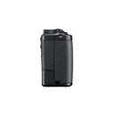 A side view of a black compact camera on a white background