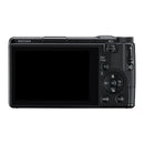 The back side of a black camera on a white background, showing the LCD display and controls.