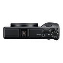 The top of a black camera on a white background, showing the hot shoe and various controls.