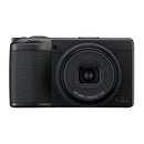 A black compact camera on a white background