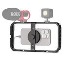 Rode Phone Cage with mounted smartphone, Rode microphone, and LED light for professional mobile filmmaking rig