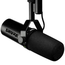 Shure SM7dB dynamic vocal microphone with built-in preamp and pop filter mounted on boom arm
