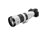 Sony FE 400-800mm super-telephoto zoom lens attached to Sony camera body with white and black design