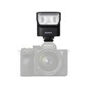 Sony camera with a flash attachment on a white background