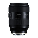 Black Tamron camera lens on a white background