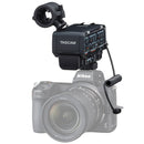 Tascam CA-XLR2d-AN XLR microphone adapter mounted on Nikon mirrorless camera for high-quality audio recording