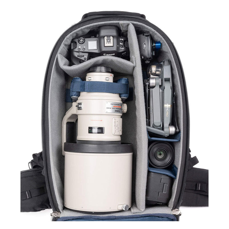 ThinkTank FirstLight camera backpack with padded compartments for DSLR, telephoto lens, drone, and accessories.