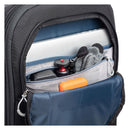 Close-up of ThinkTank FirstLight backpack front pocket with laptop, gloves, camera accessories, and organizer compartments visible