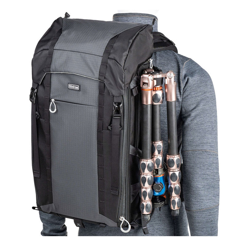 ThinkTank FirstLight 35L+ black and gray backpack with tripod attached, designed for outdoor photographers and travel.