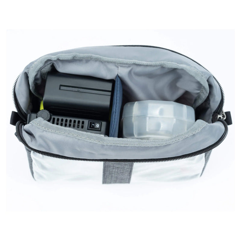 Open Thinktank Cable Management pouch showing organized electronic accessories with clear panels and zippered top designed for cable management pouches