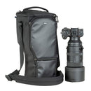Thinktank Digital Holster 150 v3 black camera lens bag with shoulder strap and telephoto lens next to it