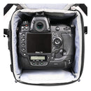 Nikon camera securely stored inside Thinktank Digital Holster 150 v3 with padded interior and top-loading access.