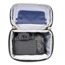 ThinkTank Digital Holster 5 v3 open with compact mirrorless camera inside, padded interior, and accessory pockets visible