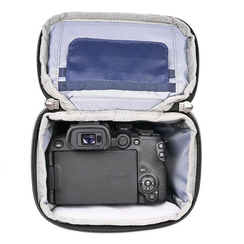 ThinkTank Digital Holster 5 v3 open with compact mirrorless camera inside, padded interior, and accessory pockets visible