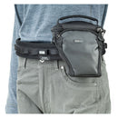 Compact black ThinkTank Digital Holster 5 v3 attached to belt, designed for mirrorless cameras with zoom lens and extra accessory pockets