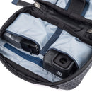 ThinkTank EDC Tech Pouch open showing organized compartments with camera and accessories inside