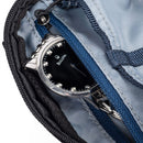 ThinkTank EDC Tech Pouch interior with organized compartments and a silver wristwatch inside zippers for tech accessories storage