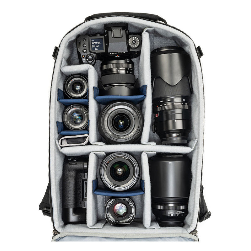 Mirrorless Mover Backpack with customizable dividers holding mirrorless camera, lenses, and accessories for organized gear storage