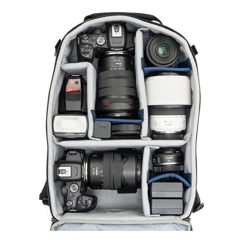 Open Thinktank Mirrorless Mover Backpack displaying organized mirrorless cameras, lenses, and accessories with customizable padded dividers