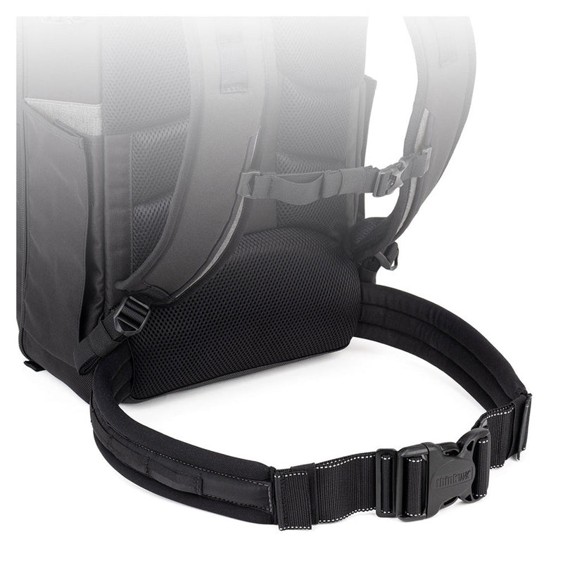 Black adjustable waist stabilizer strap and padded back panel of Thinktank Mirrorless Mover Backpack