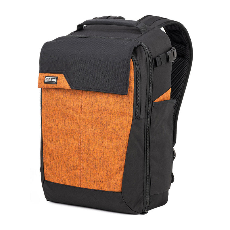 Thinktank Mirrorless Mover Backpack in black and orange with customizable dividers, padded straps, and rain cover for mirrorless cameras and gear.