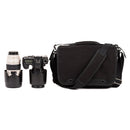 ThinkTank Retrospective 7 v2.0 black shoulder bag with adjustable strap next to camera and telephoto lens for photography storage and protection