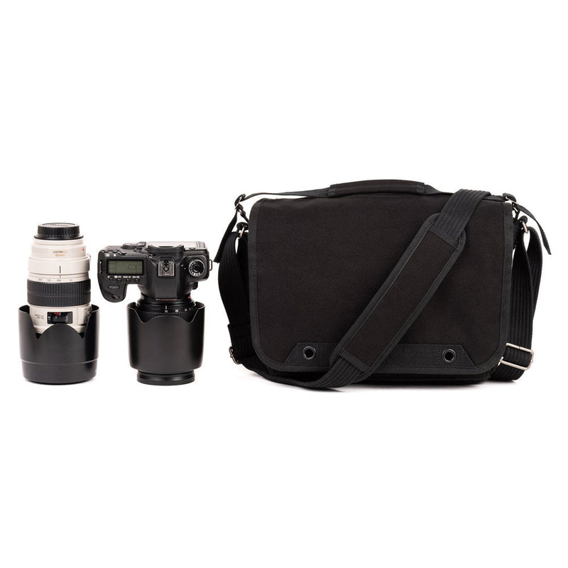 ThinkTank Retrospective 7 v2.0 black shoulder bag with adjustable strap next to camera and telephoto lens for photography storage and protection