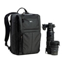 Black backpack with camera equipment on a white background