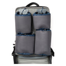 Grey and blue hook-and-loop pouches attached to the inside of the backpack