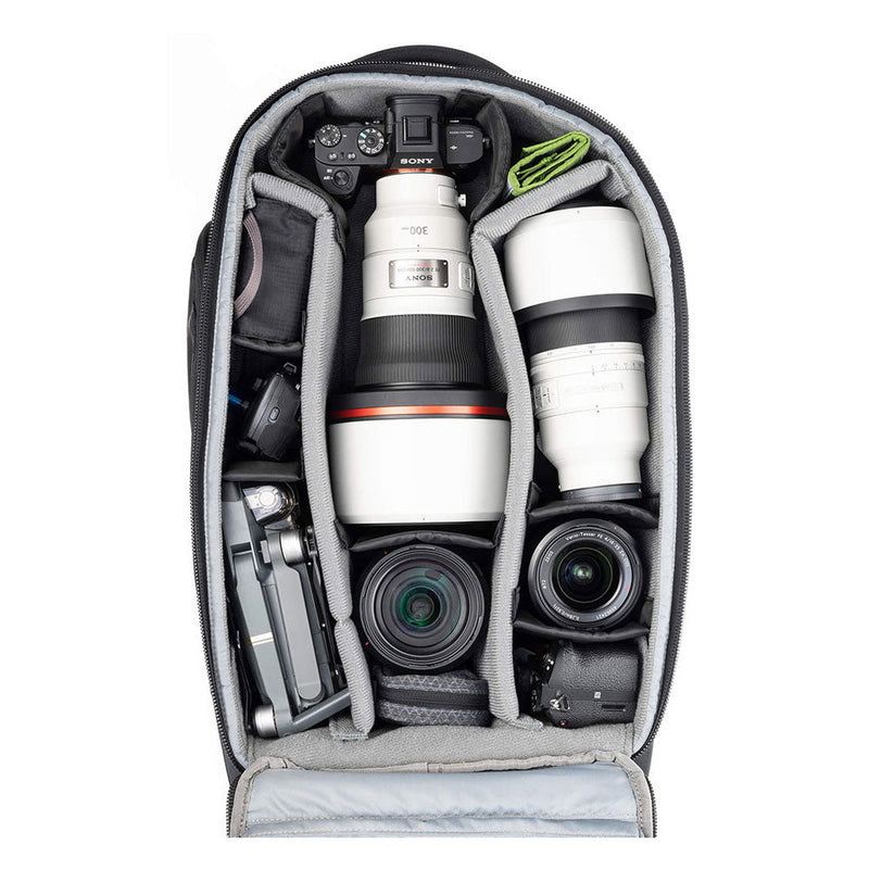 ThinkTank Walker Pro rolling backpack with organized camera gear and lenses inside compartments