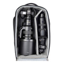 ThinkTank Walker Pro backpack open showing padded compartments with Nikon camera bodies and lenses for professional gear protection and organization
