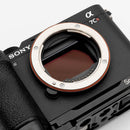 Sony a7CR camera with SmallRig plate on a white background
