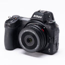 Viltrox AF 26mm f2.8 attached to a Nikon Z7 II on a white background