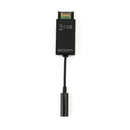 A Zoom TCA-1 timecode adapter dongle on a white background