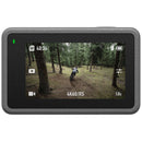 DJI Osmo Action 3 action camera showing 4K60 video of mountain biking in forest on rear touchscreen