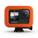 GoPro HERO camera with orange GoPro HERO Floaty protective floatation accessory for water sports