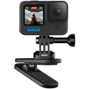 GoPro camera mounted on a black magnetic swivel clip with 360-degree rotation and a sturdy clamp for versatile positioning
