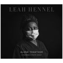 Black and white portrait of a masked healthcare worker from Leah Hennel's Alone Together pandemic photo essay