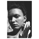 Black and white portrait of woman with dramatic lighting shot on Lomography Babylon Kino ISO 13 film